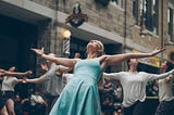 Dancing woman with outstretched arms in a group of dancers. If You Play Special Interest Roulette, You might be the smartest person in the room