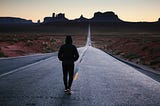 A person walking down a road that requires motivation to keep going.