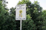Buckle up sign, Florida Turnpike. Photo by Infrogmation. License Creative Commons Attribution-Share Alike 2.0 Generic License