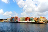 Vibrant pastel-colored buildings lined the harbor in Willemstad, Curaçao.