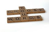 Scrabble letters that say You Choose Your Words