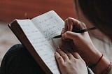 A girl writing in her journal