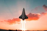 Space shuttle taking off