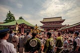 A group of festival goers at a Japanese temple.