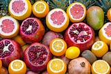 Colorful diced fruit including oranges, grapefruit, and pomegrante
