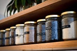 Jars with labels on a shelf