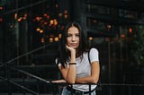 Young lady in white T-shirt looking at camera