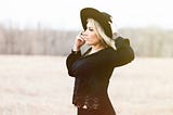Beautiful woman standing in a field