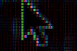 Close-up of a computer cursor arrow formed by RGB pixel strips against a dark background, showing the individual red, green, and blue elements that make up a digital display.