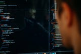 A developer using a computer to write code