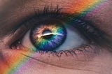 An eye with a spectrum of light across it