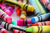 A combination of colorful crayons randomly displayed.