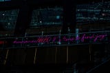 neon light that reads “#moveover2020 it’s time to find joy”