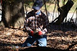 Gary Crider prepares to plant a blue mistflower during a native species planting in Athens, Georgia on Saturday, November 11. Blue mistflower attracts pollinator insects like butterflies which are essential for a healthy environment. (Photo by Alex Arango).