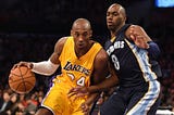 Kobe Bryant drives past Quincy Pondexter during an NBA game in Los Angeles, Jan. 2, 2014.