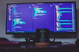 a computer screen and a coffee cup that has the slogan “Life begins at the end of your comfort zone”