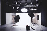 On the Set with lights on and white backdrop