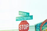 Stop sign at an intersection, featuring additional street signs that say, “Homework Avenue” and “Procrastination Park.”