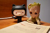 don’t know why this picture showed up on Unsplash, since my search term was Git. The picture shows Groot and Octocat reading a newspaper