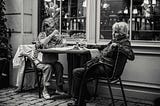 Photo of Elderly Women Sipping Wine on a Patio Outside an Establishment by Jez Timms on Unsplash