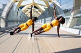 Two women exercising.