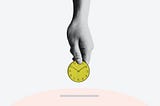 Person holding a yellow, round, analog clock