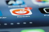 Close up shot of reddit icon on a smartphone