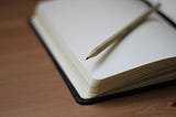 A blank Moleskine notebook