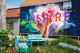 A walled garden bearing the inscription ‘inspire