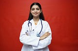 A female doctor wearing a white lab coat and stethoscope.