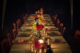 A spookily lit dinner scene