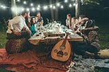 Group of friends having a dinner party outside