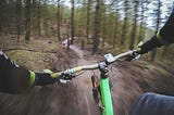 A cyclist riding through a winding forest trail, symbolizing the journey toward balance and finding an easier path in life.