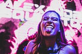 Girl at a party sticking out her tongue