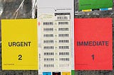 Triage card in hospital. Red is immediate, yellow is urgent, green is delayed, white or black is dead.