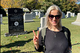 Women standing near grave of RBG