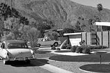 Photo of midcentury modern house and cars