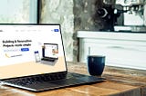 Laptop on a table open to the iknowa website