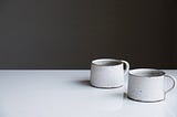 Two mugs on a table