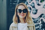 Older woman smiling wearing a sunglasses