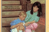 Mary Anne helps a young boy who has scraped his knee.