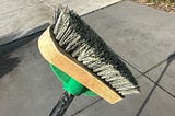 What is a deck brush and what is it used for?