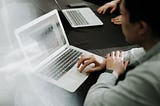 A person working on a laptop.