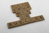 Photo of scrabble tiles that read, “Fail your way to success.”