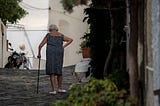 a lady walking with a cane