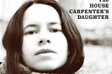 The cover art of Natalie Merchant’s ‘The House Carpenter’s Daughter’ album shows her looking at the camera. The photo is in black and white. The title is in the upper right-hand corner in black type and block lettering. Merchant’s name appears in a banner across the top with a light blue background. The words ‘a collection of tradional & contemporary folk music’ run across the bootom in white type against a black background.