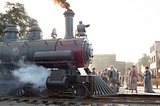 A red steam train pulls into the small town of Sweetwater..