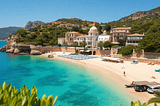 A scenic view of Mallorca showcasing crystal-clear beaches, lush greenery, luxury villas, and charming townhouses, embodying the allure of Mediterranean living.