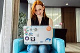 Developer woman codes on her laptop.
