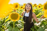 Girl in field of sunflowers